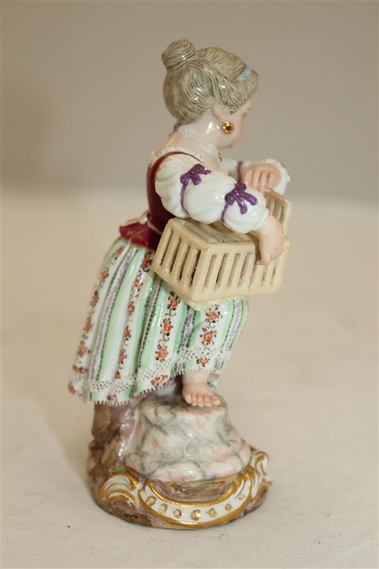 A Meissen figure of girl holding a birdcage, 19th century, 11.5cm